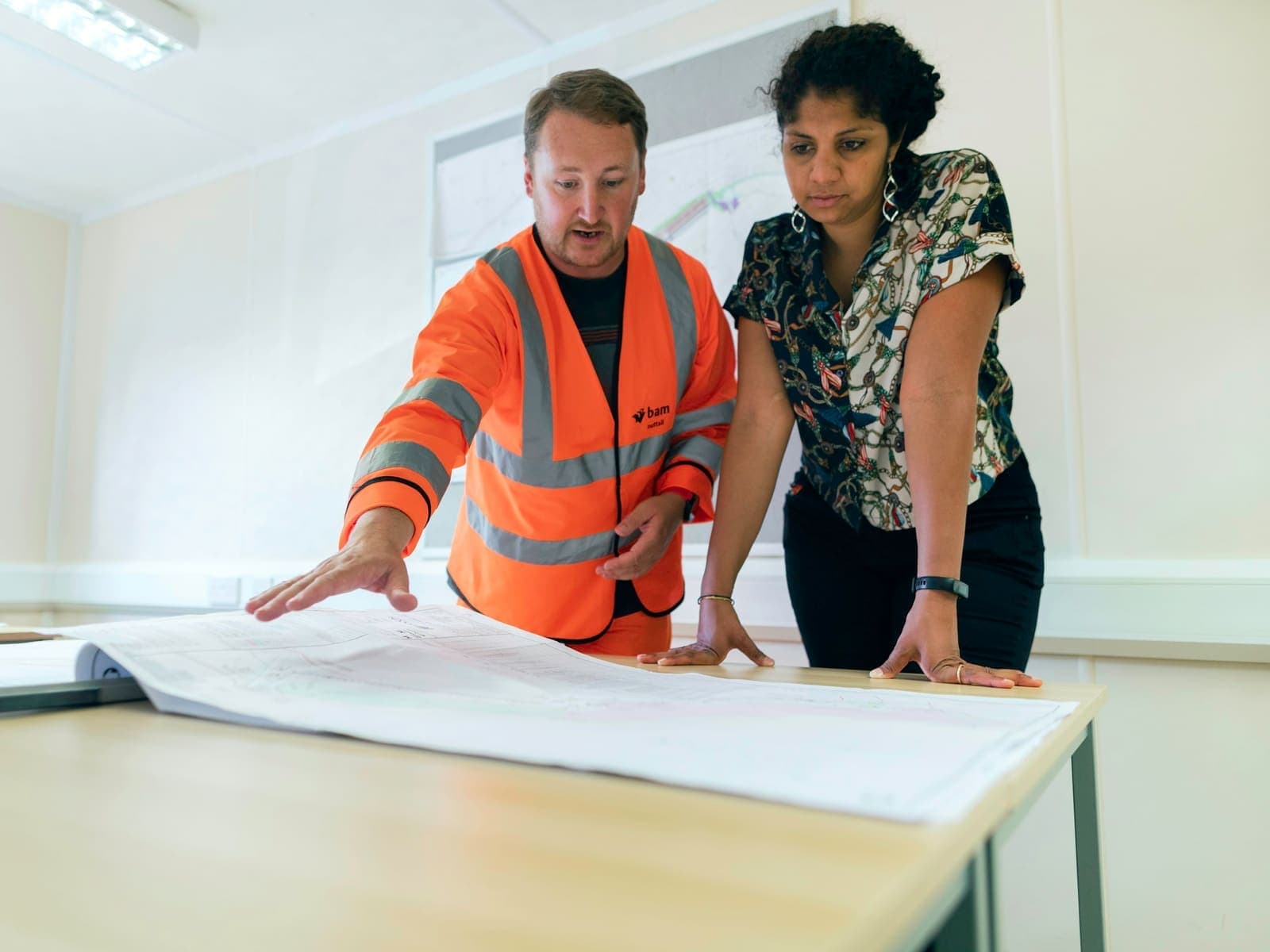 Project team reviewing construction drawings